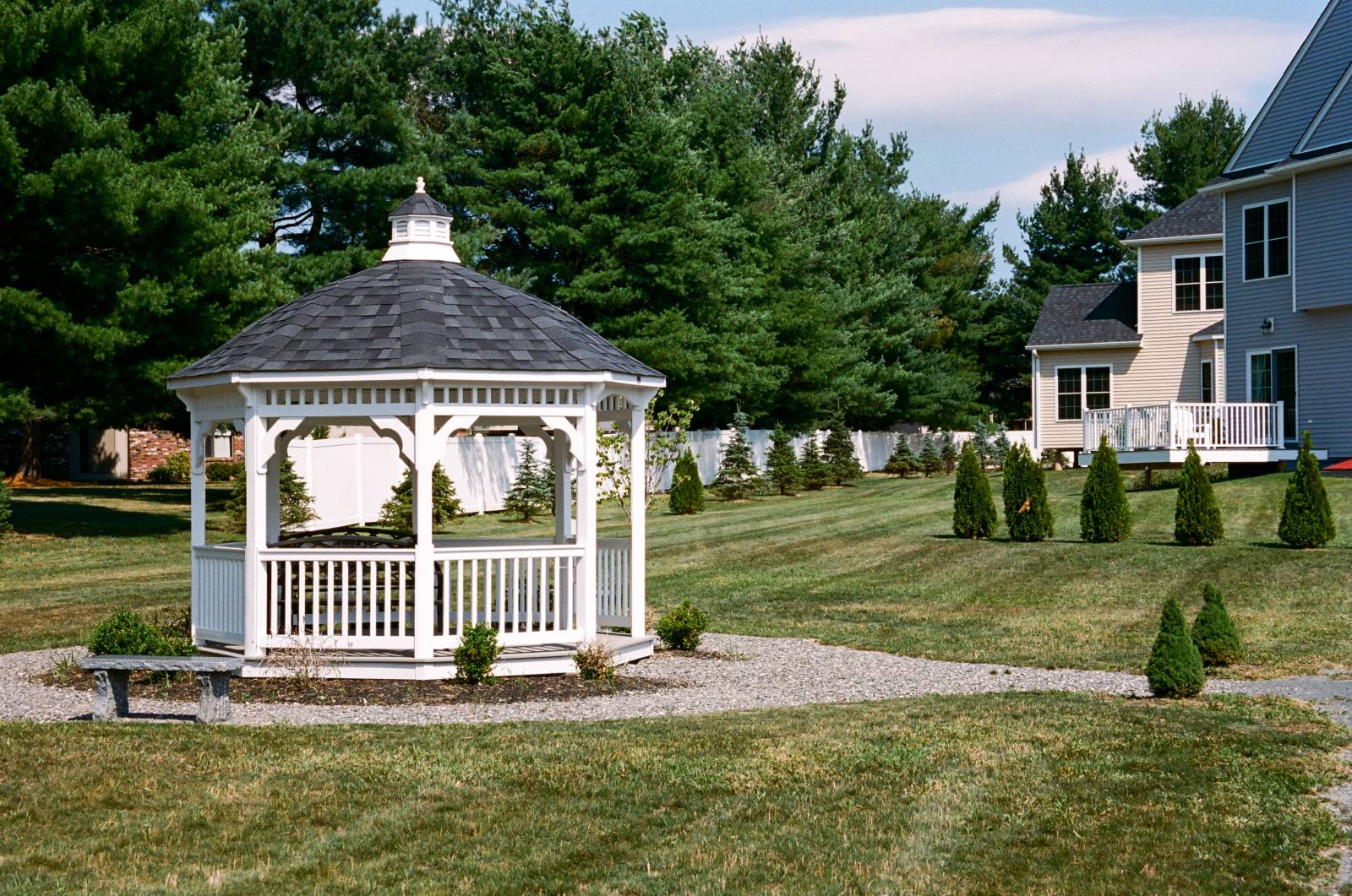 Bell Top Gazebo with standard rails in a neighborhood park