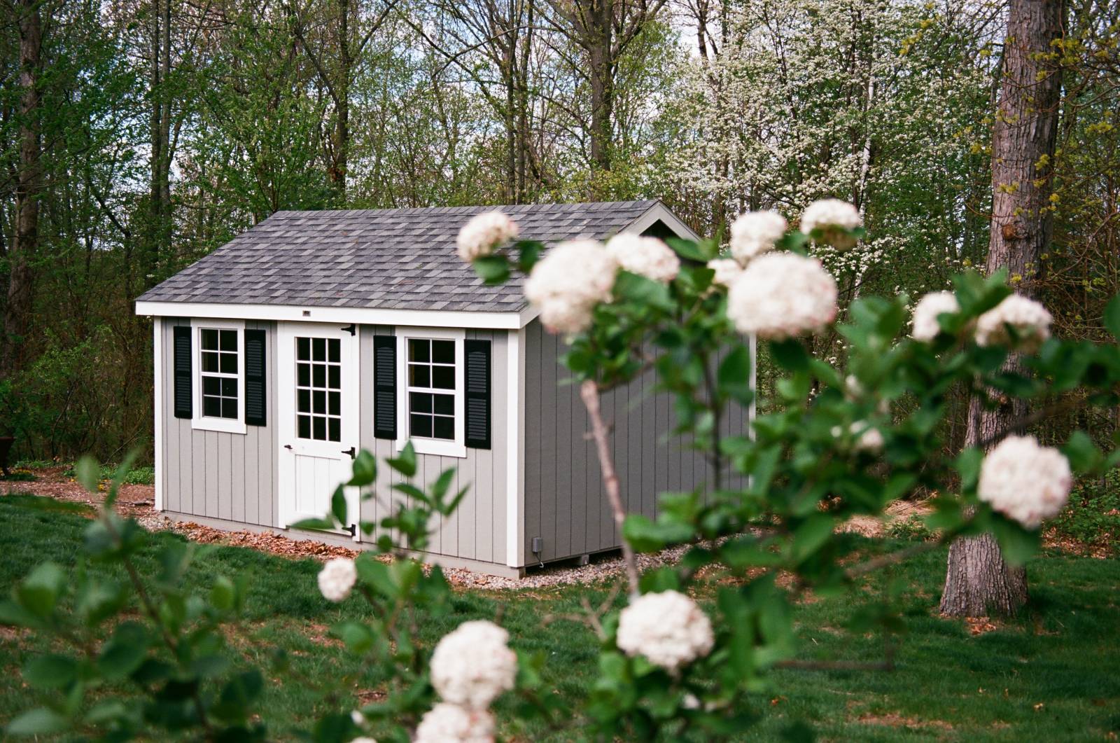 3' Single Door with Square Half Glass • 24x36 4/4 Windows with 12"³ Black Louvered Shutters