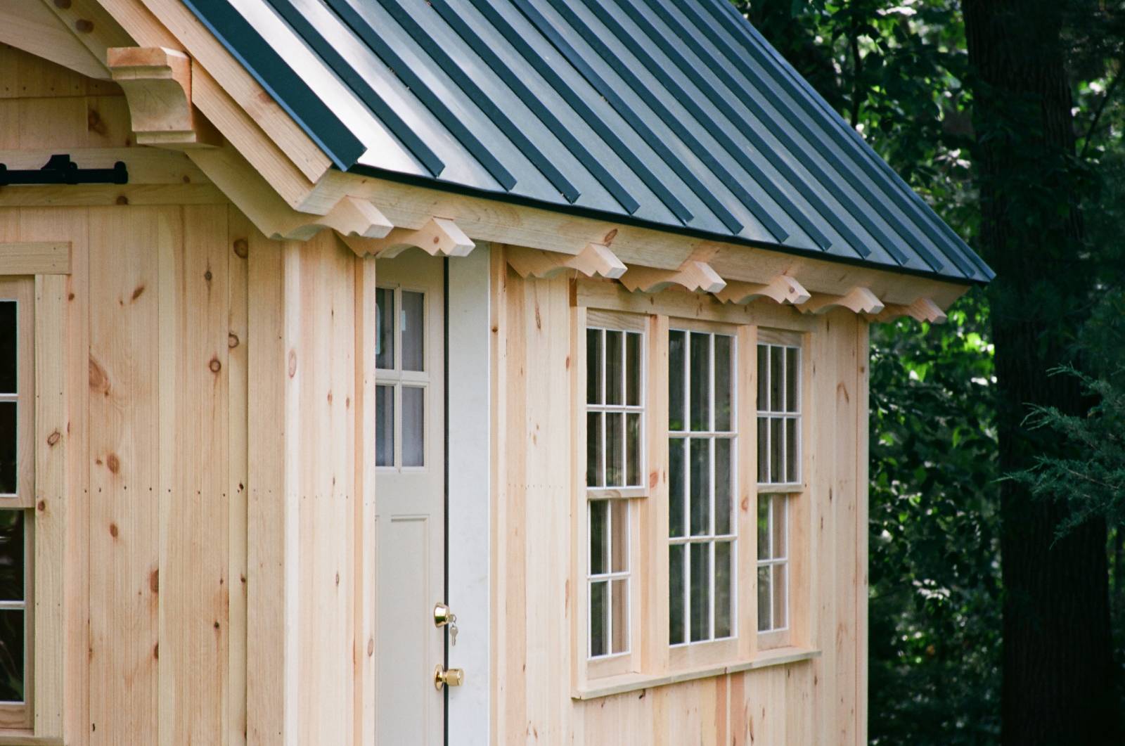 Decorative rafter tails & standing seam metal roof