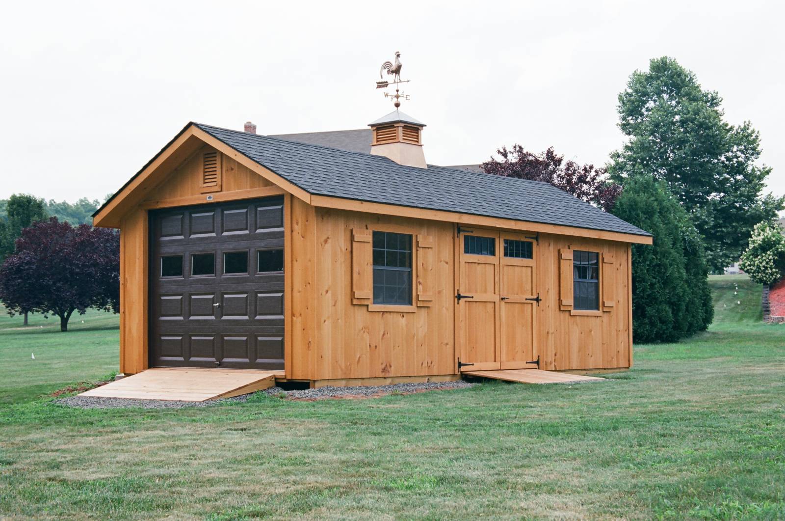 12' x 24' Victorian Cape Garage • Pine Siding • Natural Stain • Rustic Black Shingles • Cupola & Weathervane