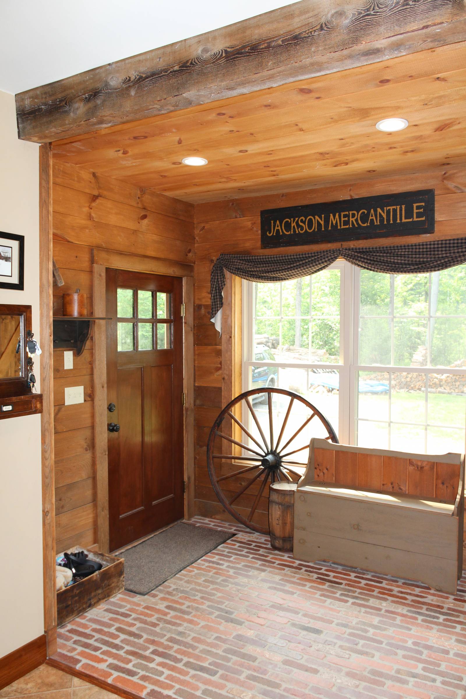 Inside the mud room (notice the reclaimed beam overhead)