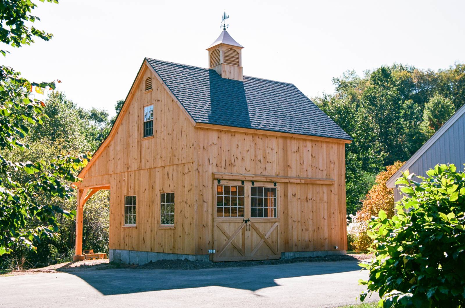 Front of the Barn • Pine Sliding Barn Doors with Half Glass • Sash Windows • Single Hung Window with Screen