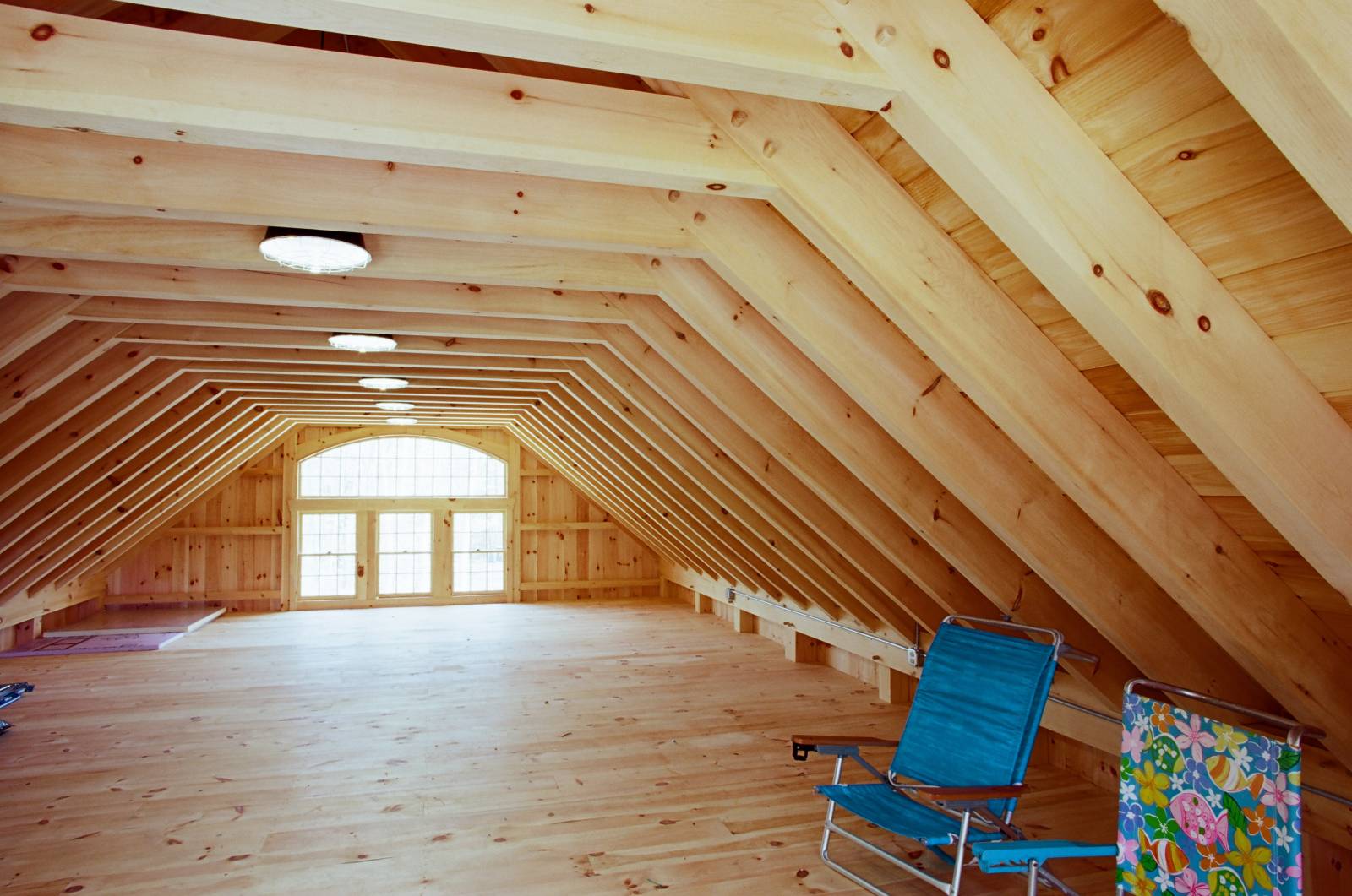 Spacious second floor of the Carriage Barn. Notice the timber rafters & collar tie system.