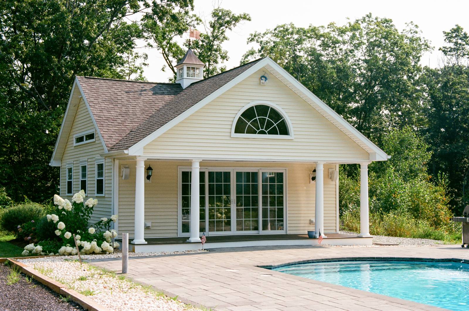6' x 24' Covered Porch with Composite Decking • Vinyl Siding (Color: Cream) • White 1x3 Trim