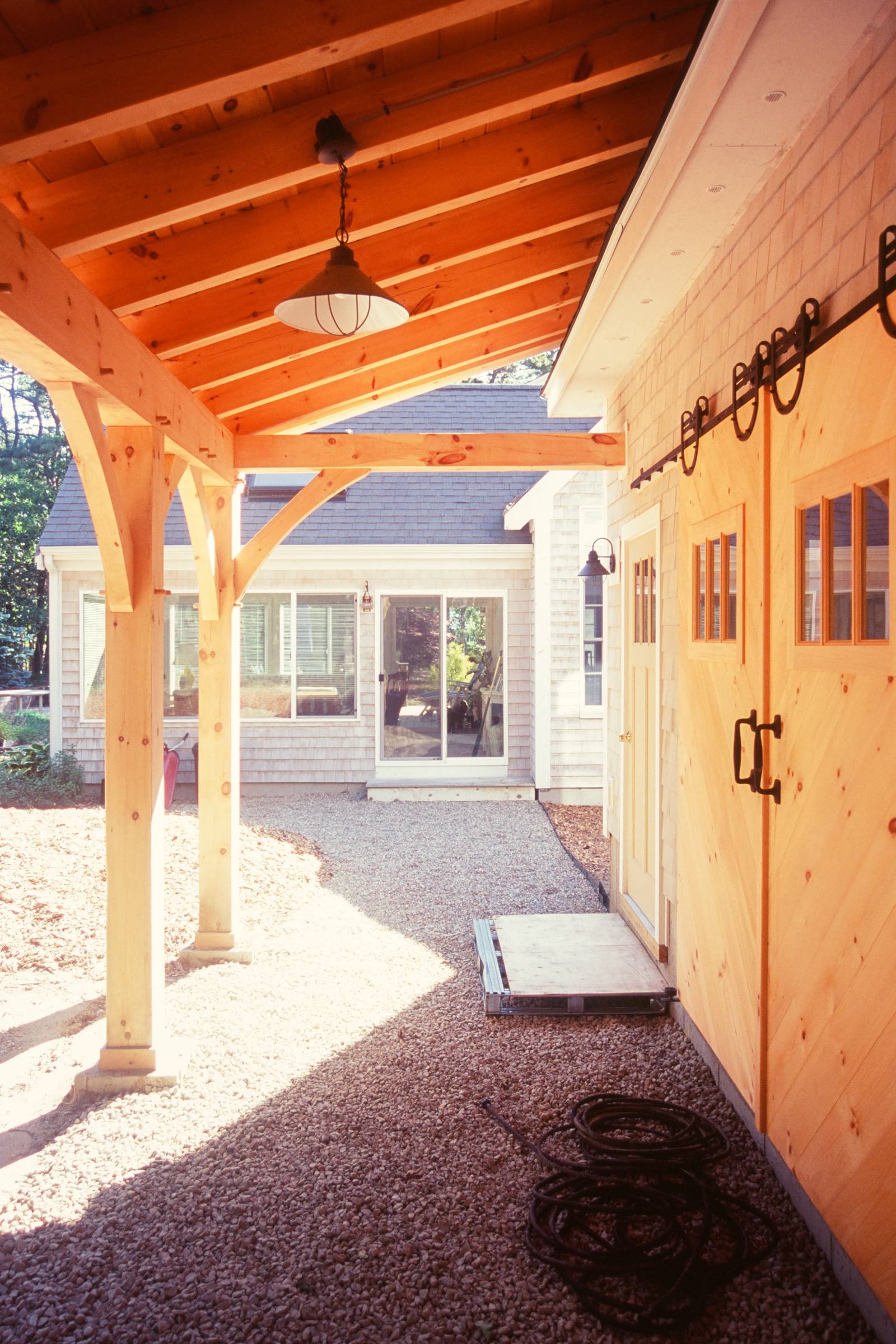 Under the timber frame overhang