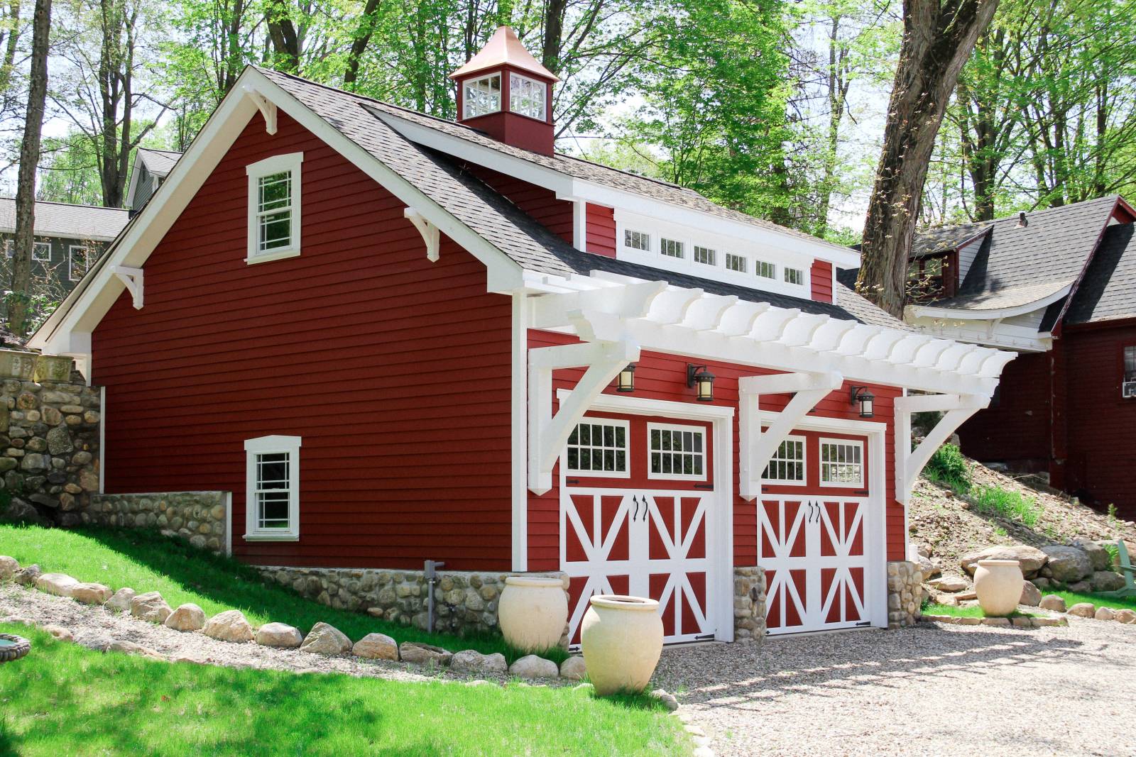 24' cedar timber frame pergola (painted white) over garage doors • 16' transom dormer