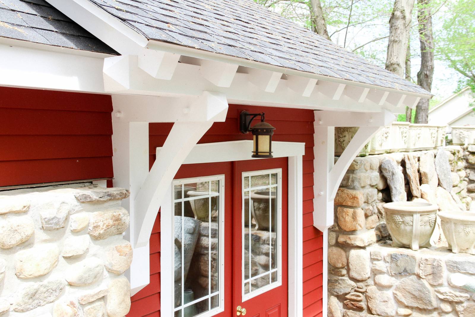 Timber frame eyebrow roof over rear door
