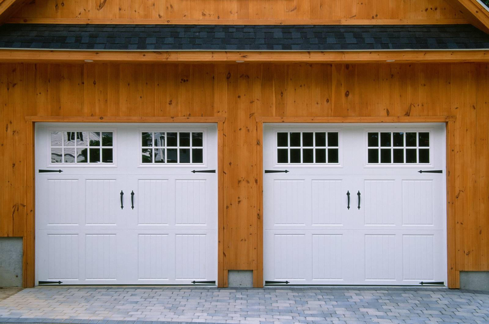 (2) 9' x 8' Amarr Classica Carriage Style Steel Insulated Overhead Doors with Glass & Strap Hinges/Handles • Shingled Eyebrow Roof (above overhead doors)