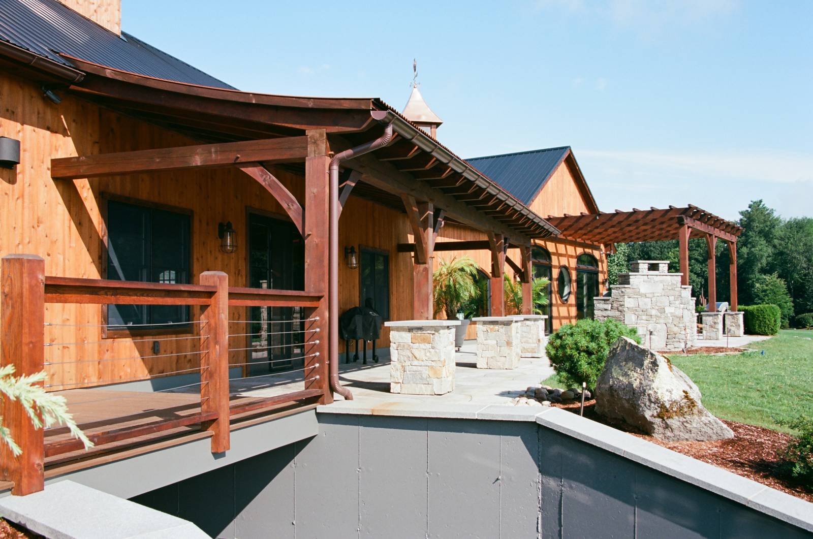 Timber Frame Overhang with Curved Rafters