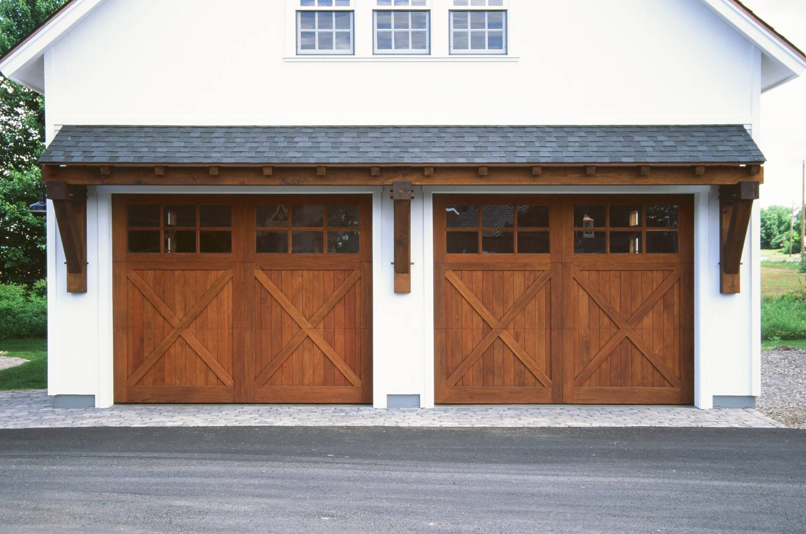 24' Big Sky Timber Frame Eyebrow Roof over two 10' x 8' Spanish Cedar Overhead Doors