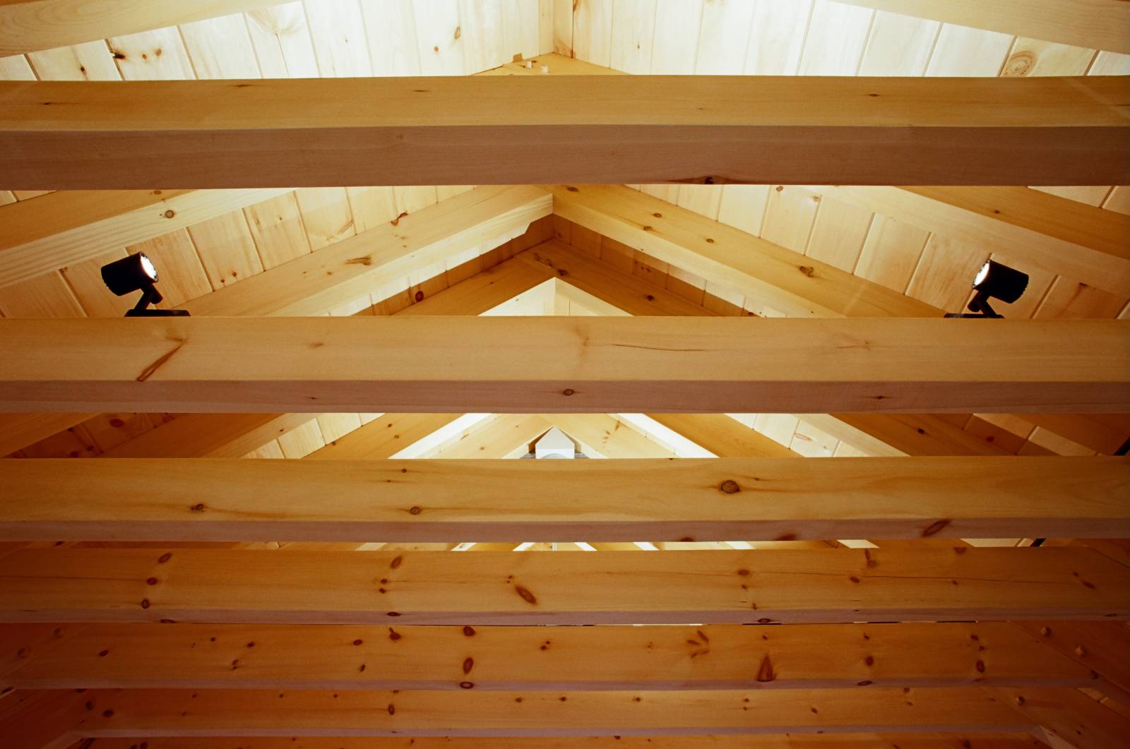 The customers installed lighting that points up at the timbers to accentuate the design and provide soft reflected light