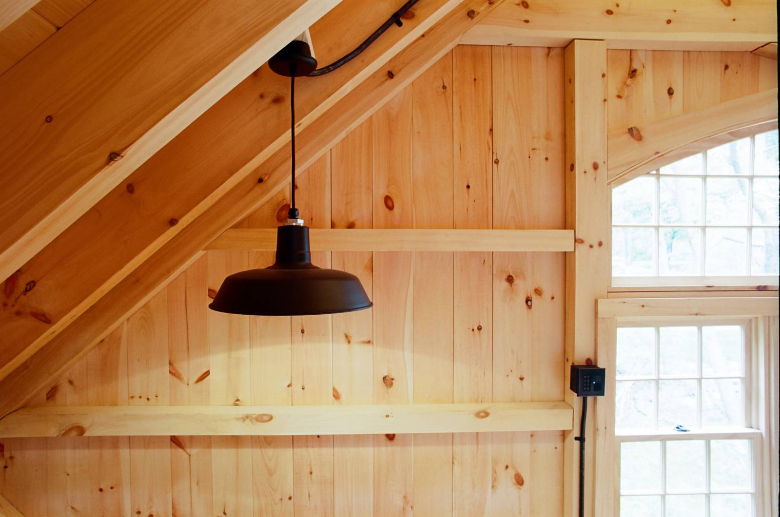 Pendant barn light above stairway