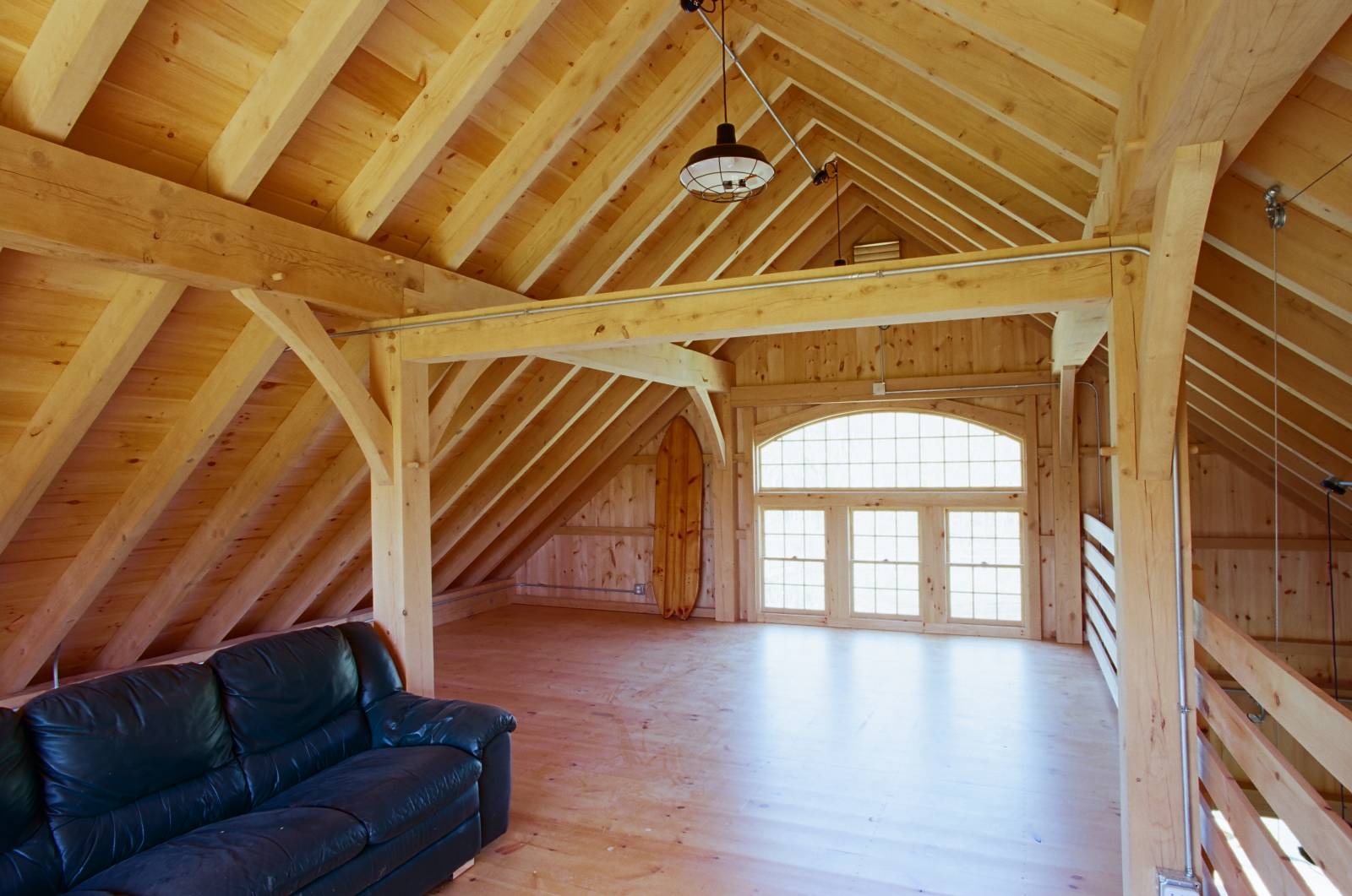 Looking the opposite way on the second floor. Notice the bow top window with pine single hung windows below.