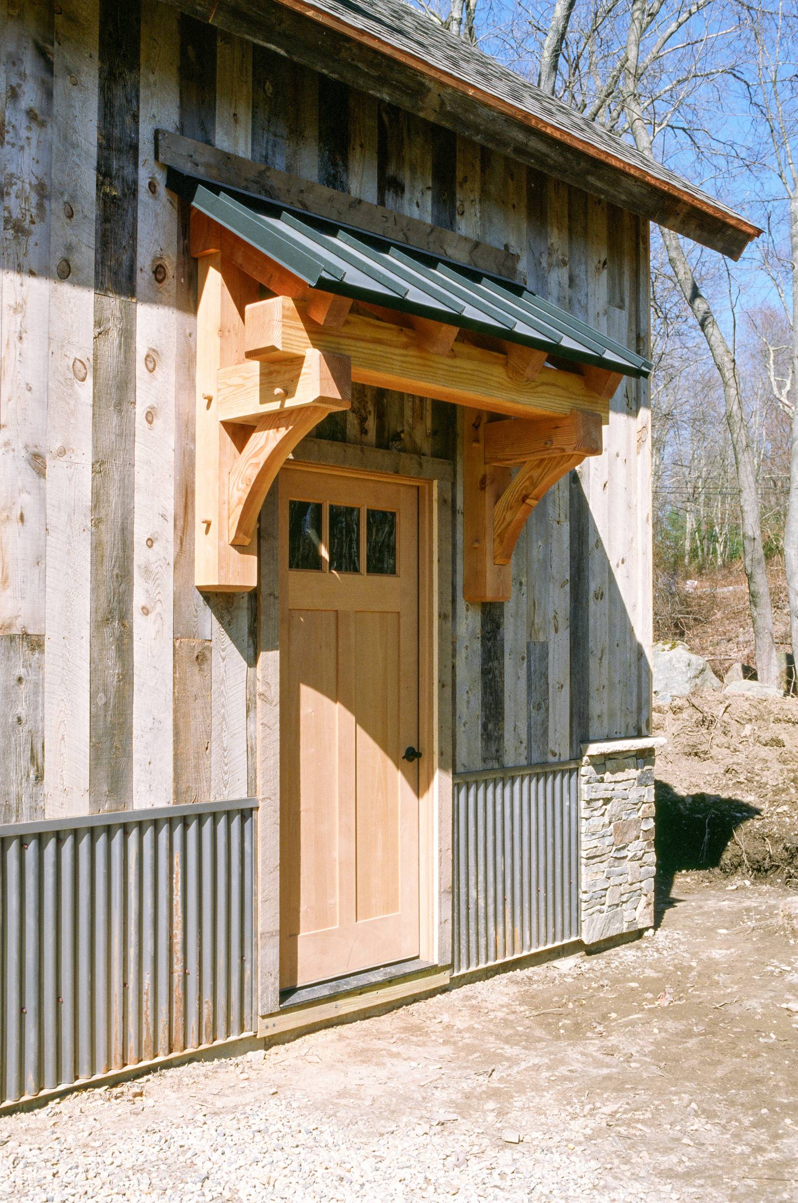 Douglas Fir Timber Frame Eyebrow Roof with Metal Standing Seam