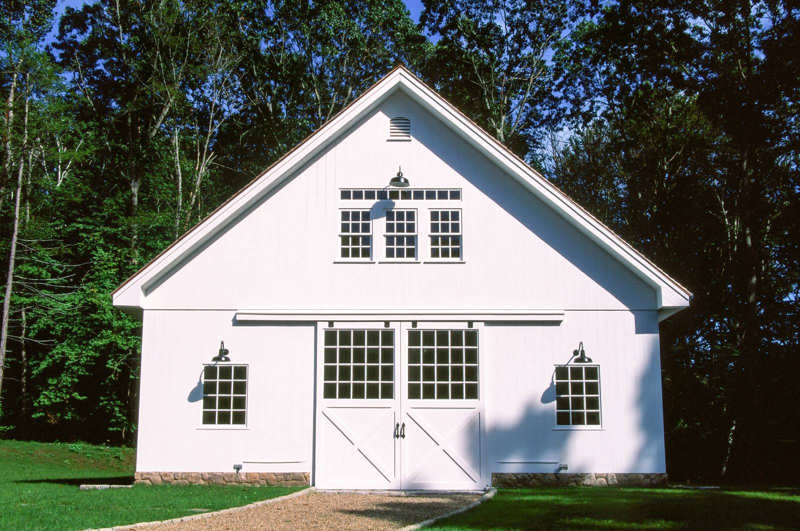 Face of the Barn • Split Sliding Barn Doors with Half Glass • True Divided Light Windows