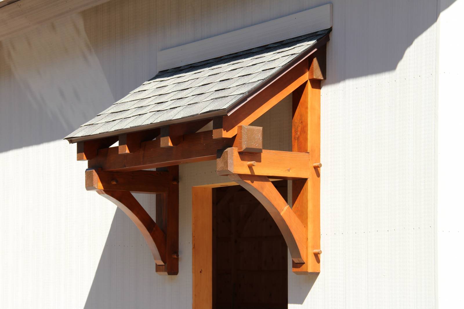 Exterior: Timber Frame Eyebrow Roof