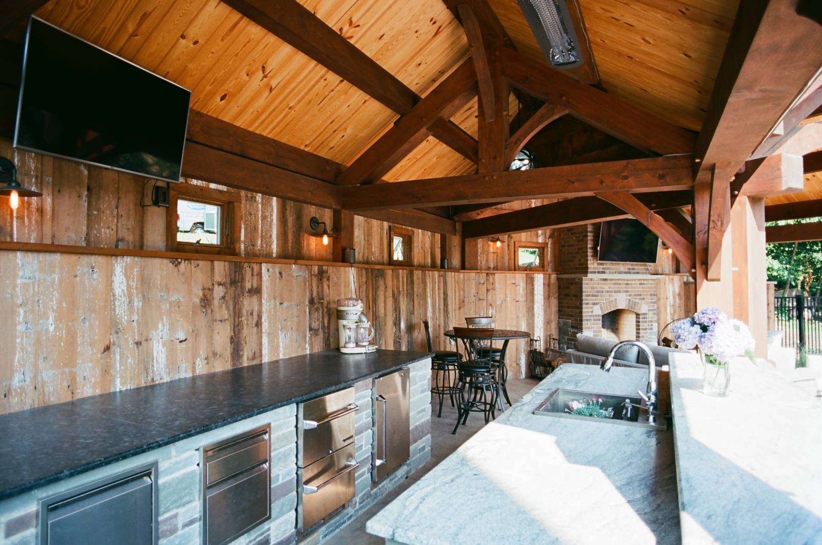 Outdoor Kitchen in Timber Frame Pavilion (notice the reclaimed barn board siding)
