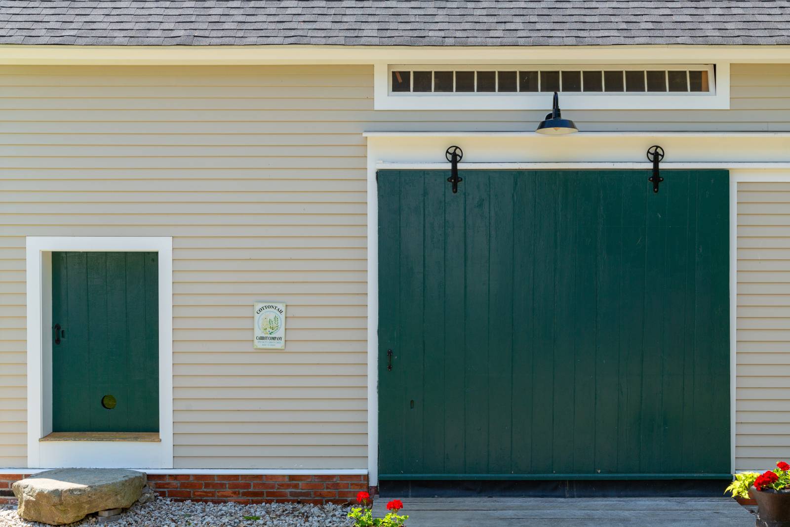 Transom Windows and Sliding Barn Door on the Right • Small Access Door for Post & Beam Barn on the Left