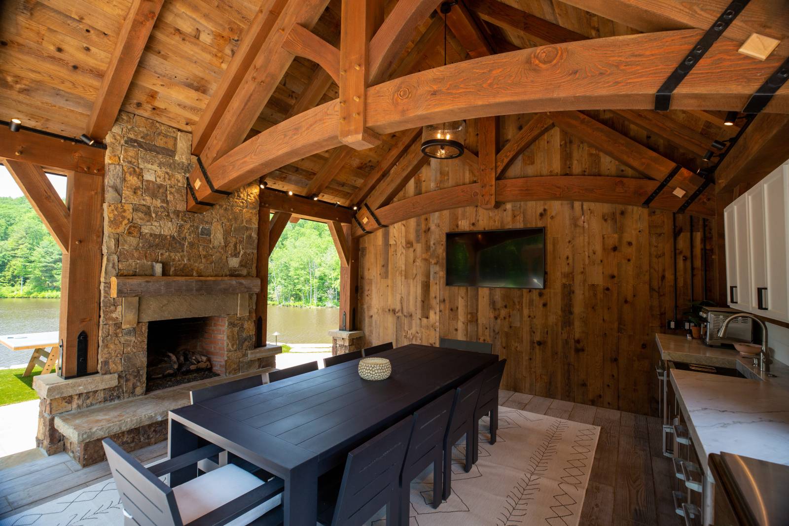 Under the Pavilion • Fireplace, Dining Area, and TV 