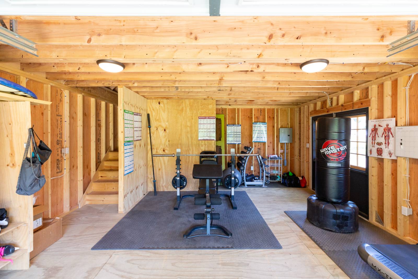 Workout Station • Stairs to the Left • Double Doors to the Right