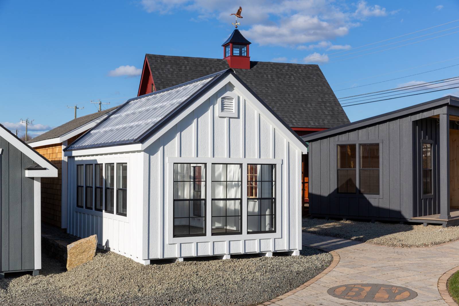 Board and Batten Siding • Several Windows • Greenhouse