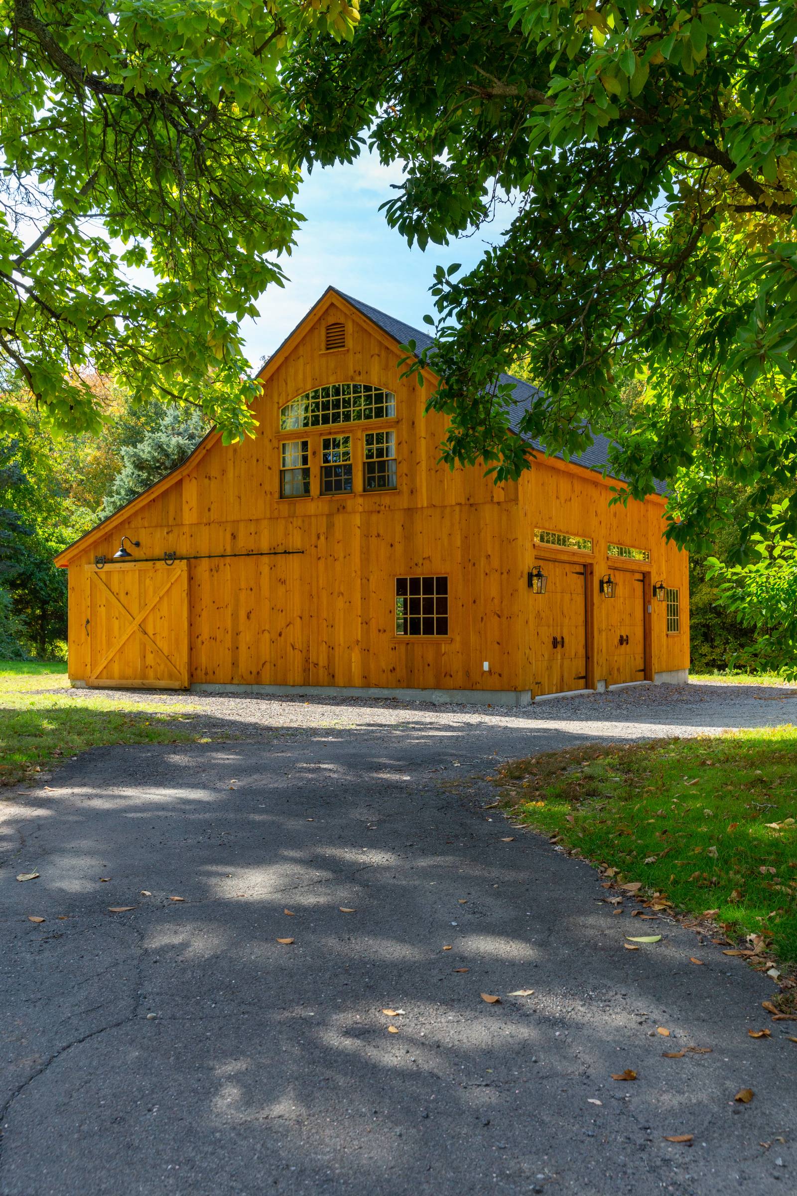 Pine Siding • 10-12 Roof Pitch • Bow Top Windows • Timber Frame Barn