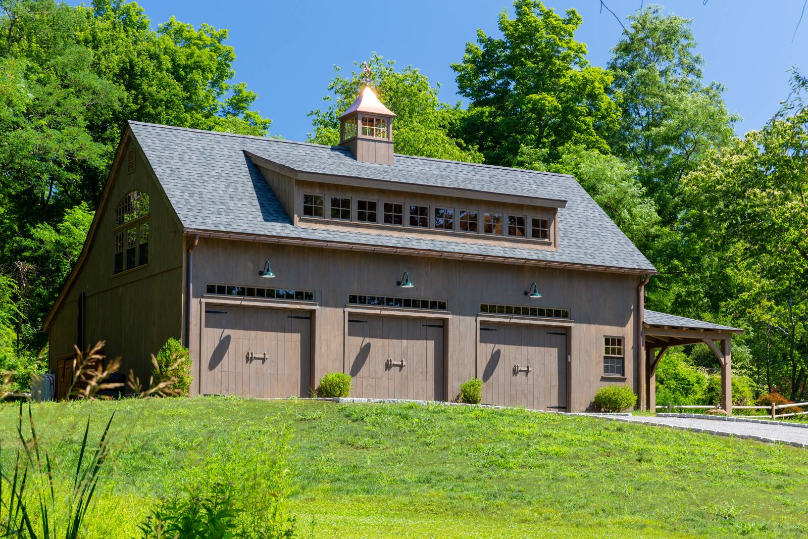 Three Overhead Doors • 20' Transom Dormer • 42" Cupola