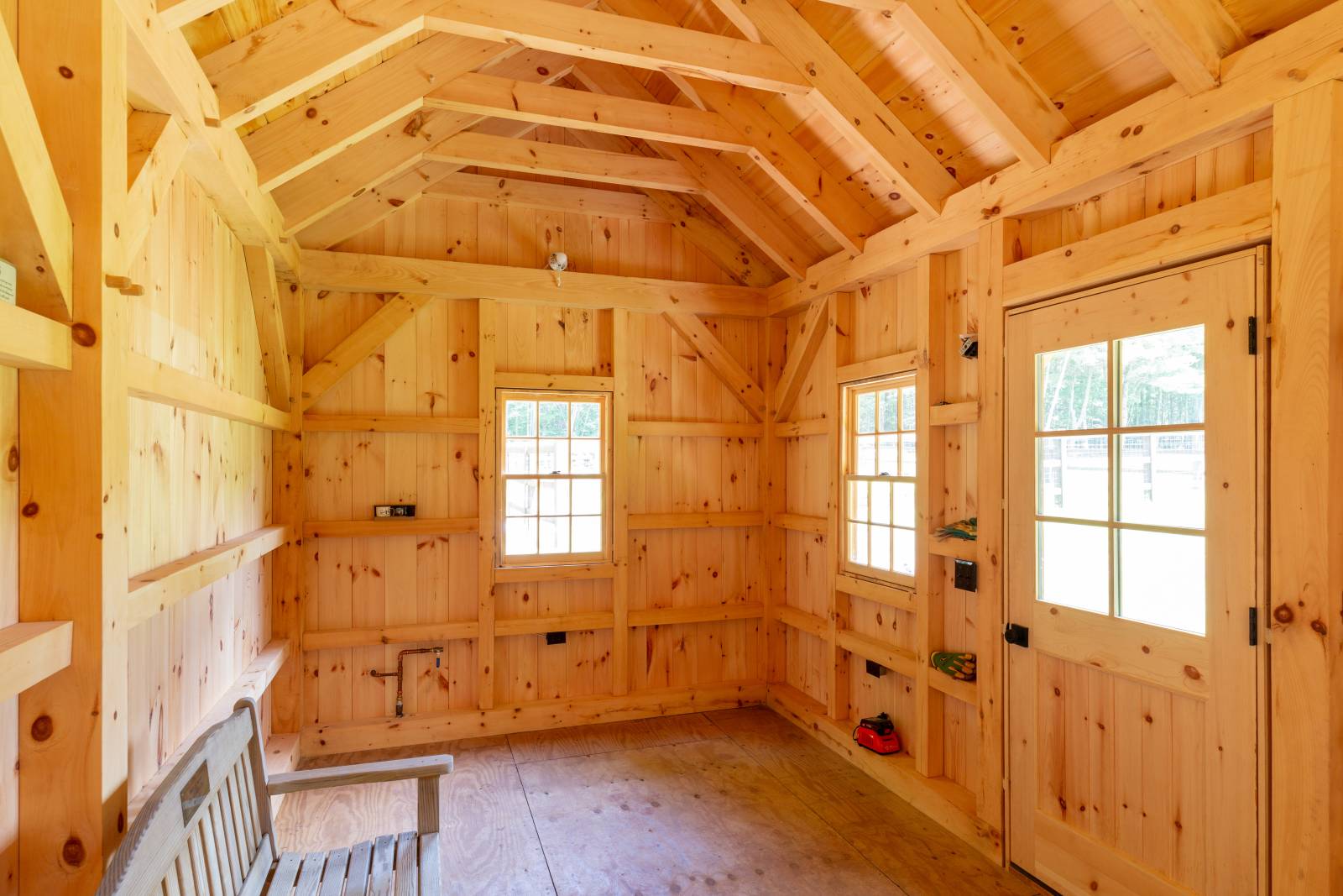 6x6 Timber Sills, 6x6 Posts, 6x8 Rafter Plates, 4x8 Arched Braces, 4x4 Siding Nailers • Timber Frame Cabin