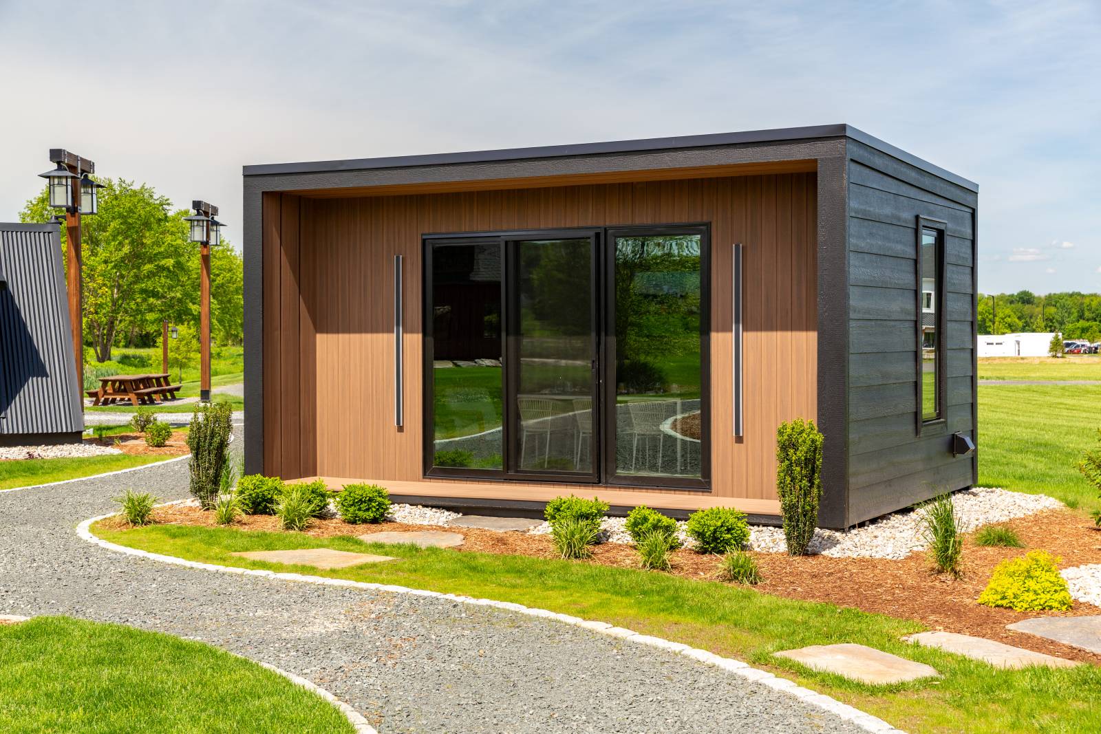 Modern design with slimline overhangs, rubber roofing, and porch