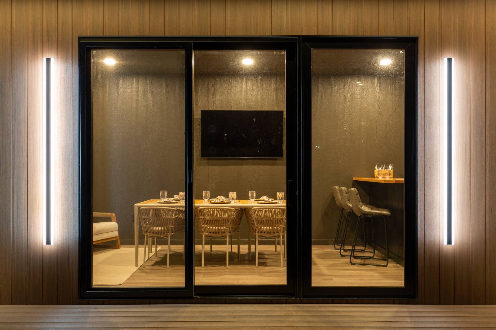 Two 69" Haylen Lights frame the sliding door