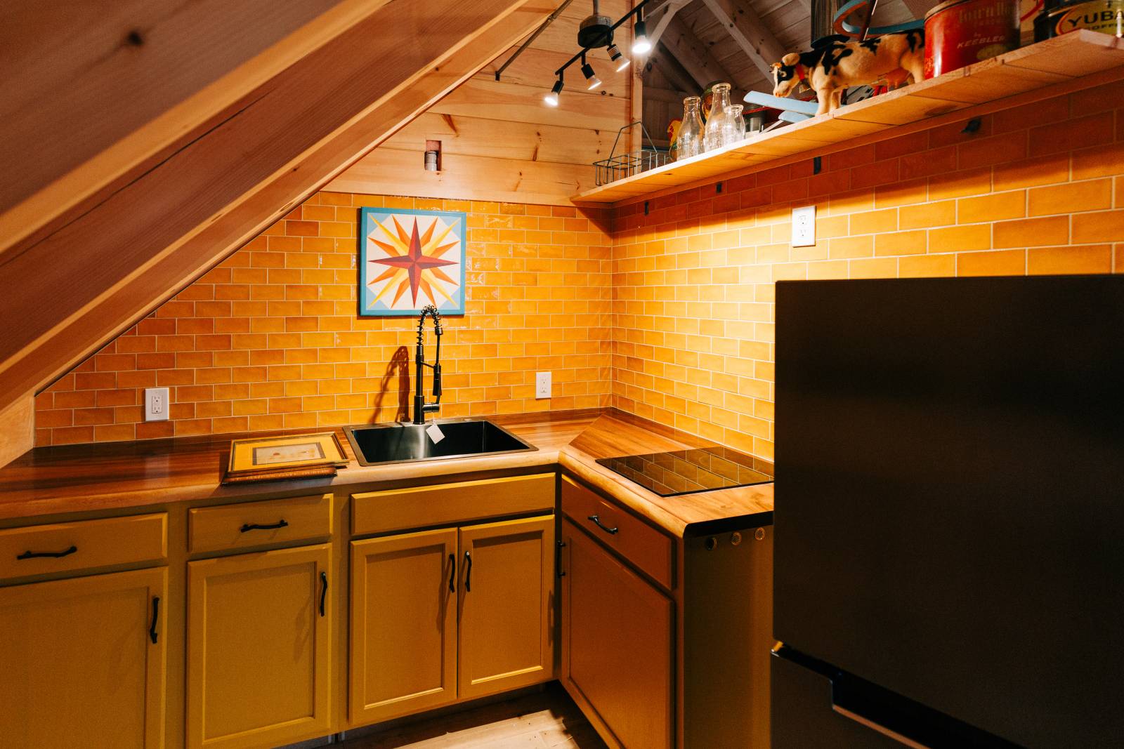 The kitchen in the post & beam barn loft