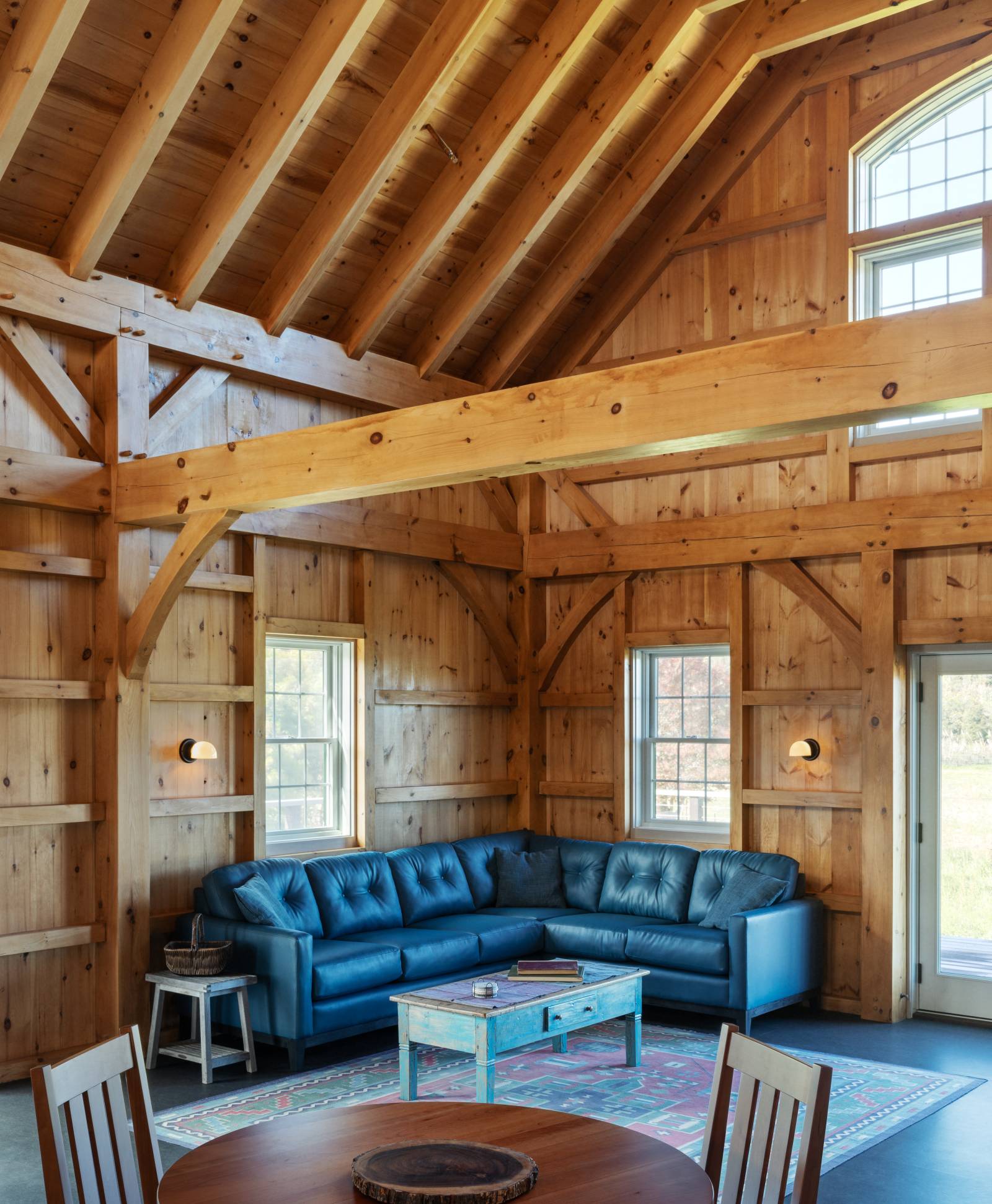 The living area with cathedral ceilings & exposed timbers 