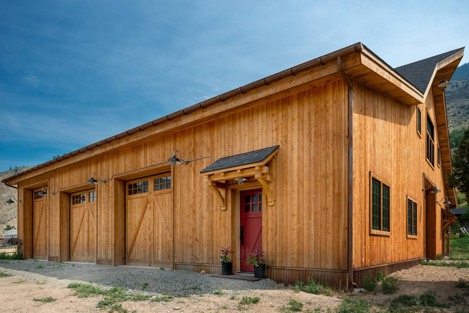 14' x 56' enclosed lean-to with overhead doors & timber frame eyebrow roof