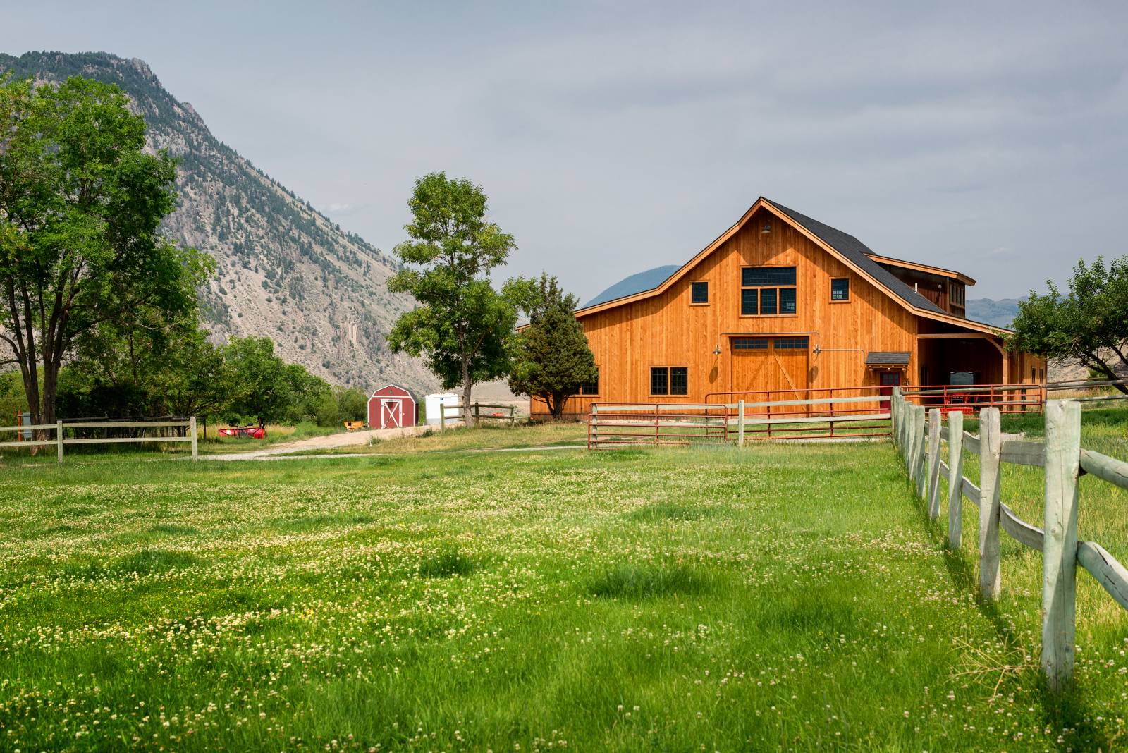 The post & beam barn fits right in with the rural Montana landscape