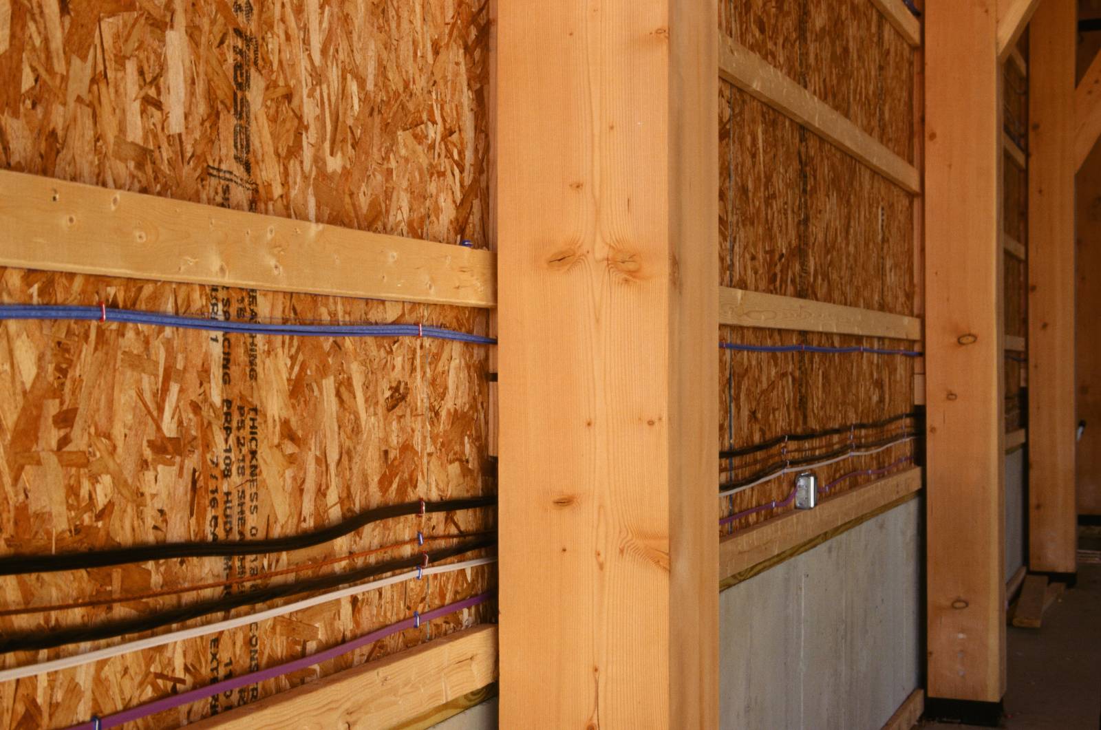 Spacers create room between SIPs and timbers for utilities