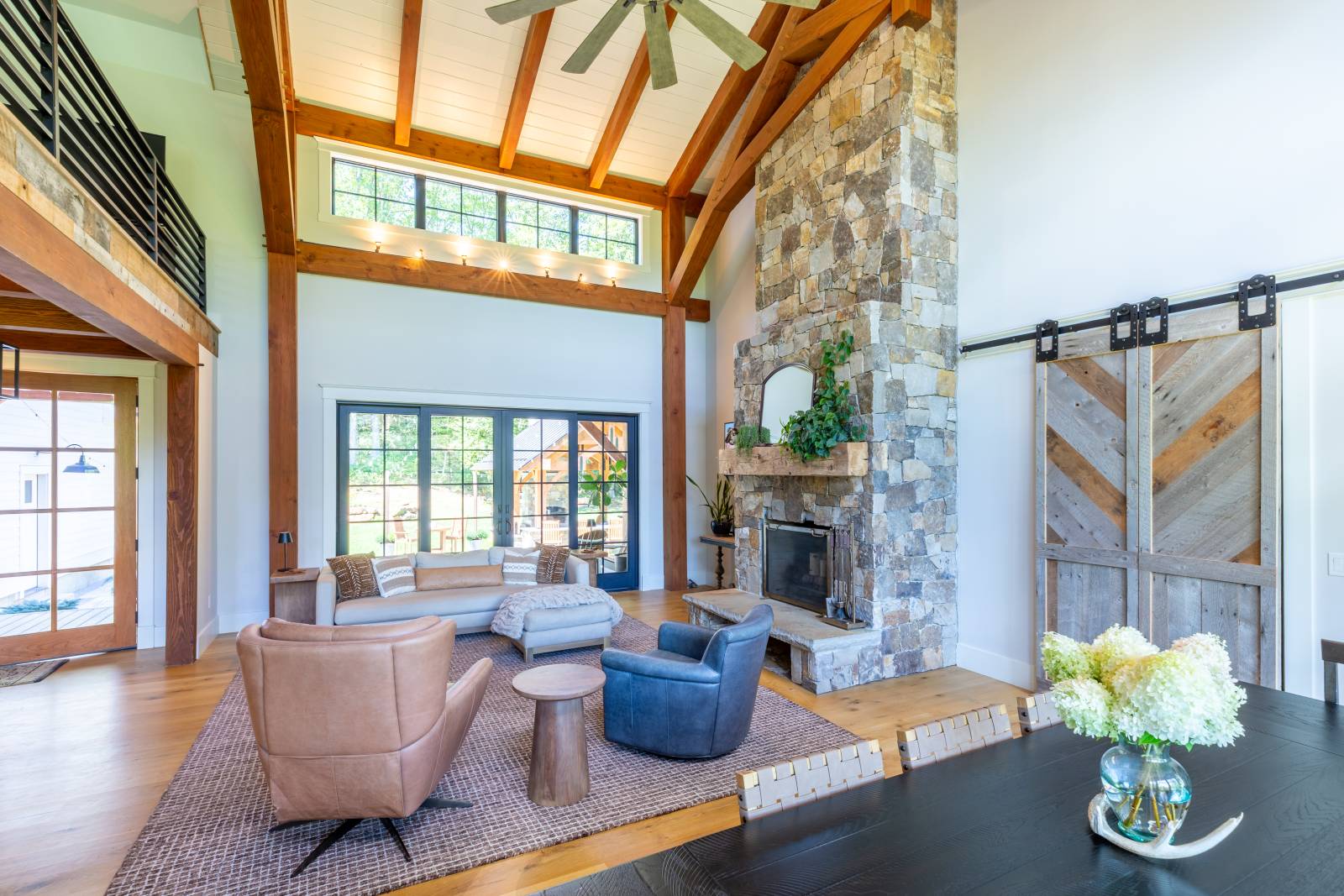The timbers extend to the great room’s cathedral ceiling