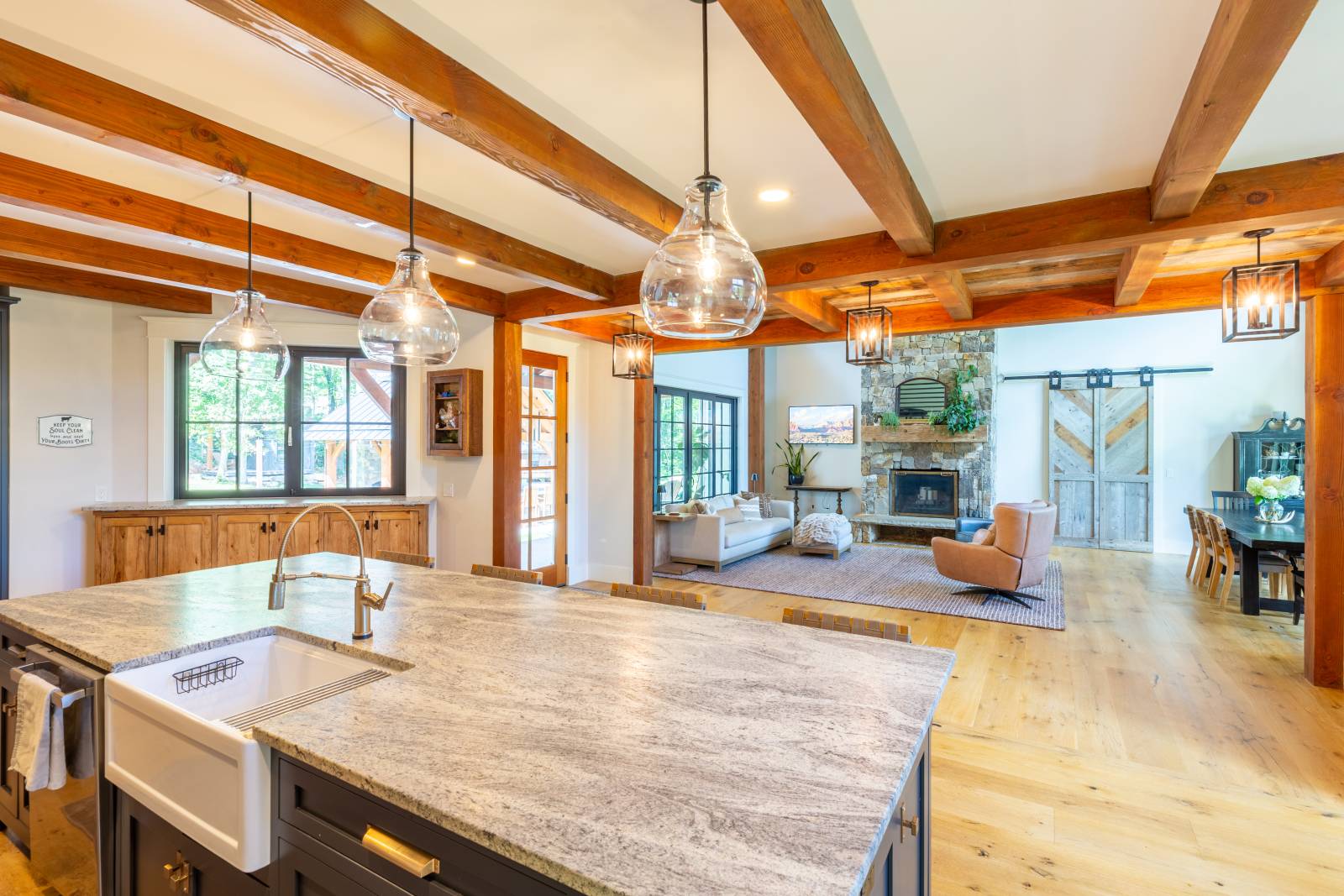 A timbered ceiling adds a rustic element to the kitchen