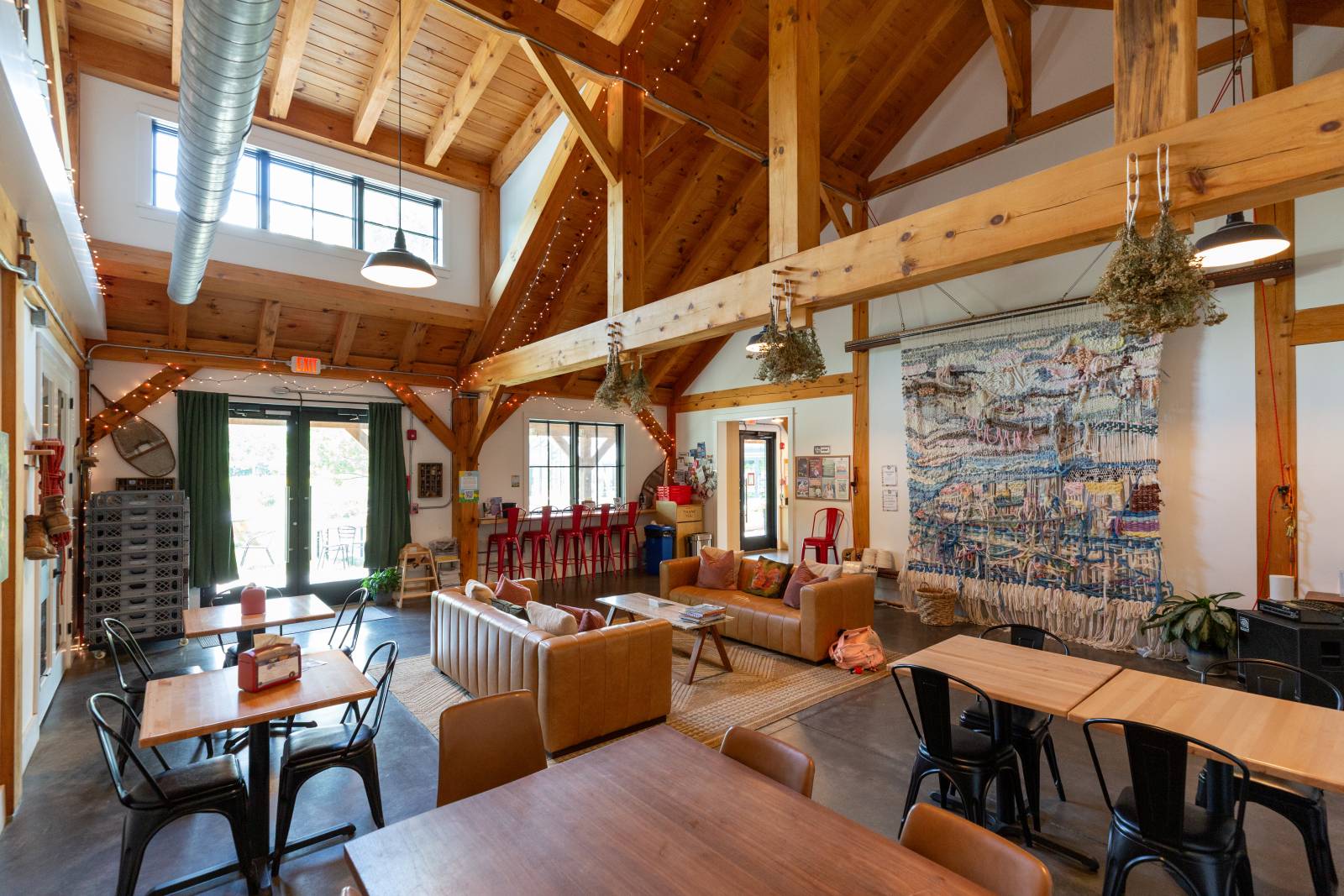 A transom dormer and glass doors let light flow throughout the nature-inspired interior