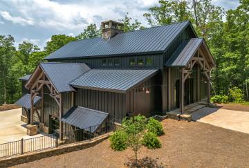 The timber frame entryways hint at the detailed post & beam interior
