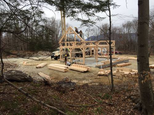 Starting to crane the heavy timber roof rafters