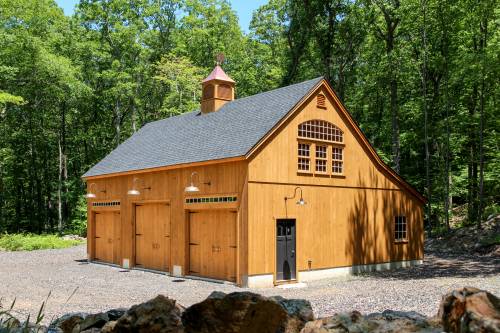 3 Overhead Doors on this 32x40 Carriage Barn Garage