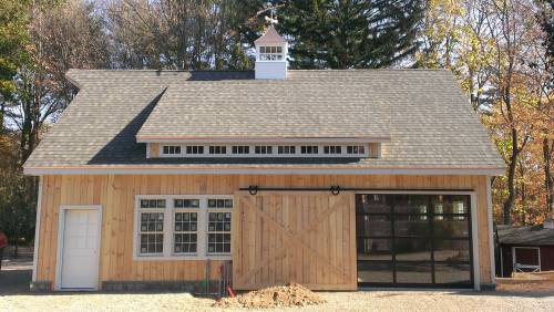 Sliding Barn Door Open Revealing Glass Garage Door