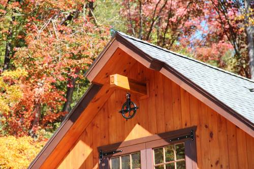 Faux hoist beam with turkey tail gable peak