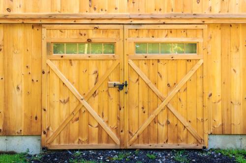 Double Sliders with Transom Windows Covering Functioning Overhead Door