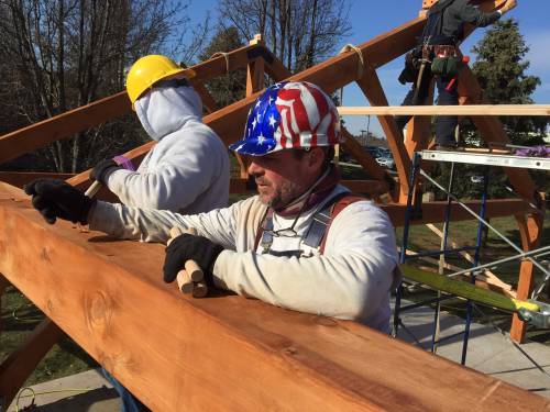 Chris holding "timber framer's nails" (AKA oak pegs)