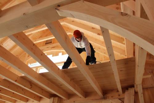 John works on the loft decking