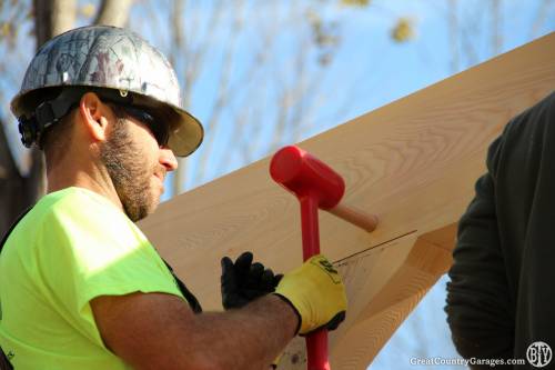 Joel hammers in an oak peg