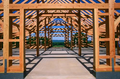Photo showing the expansive timber frame structure from the center aisle