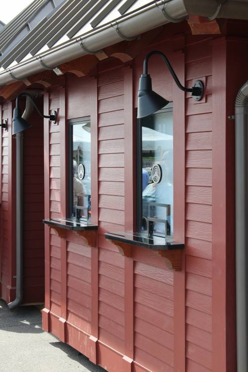 Two windows on each ticket booth • Notice the decorative siding details