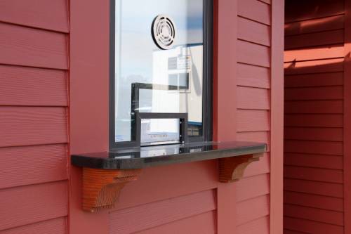 Granite exterior shelf with timber brackets